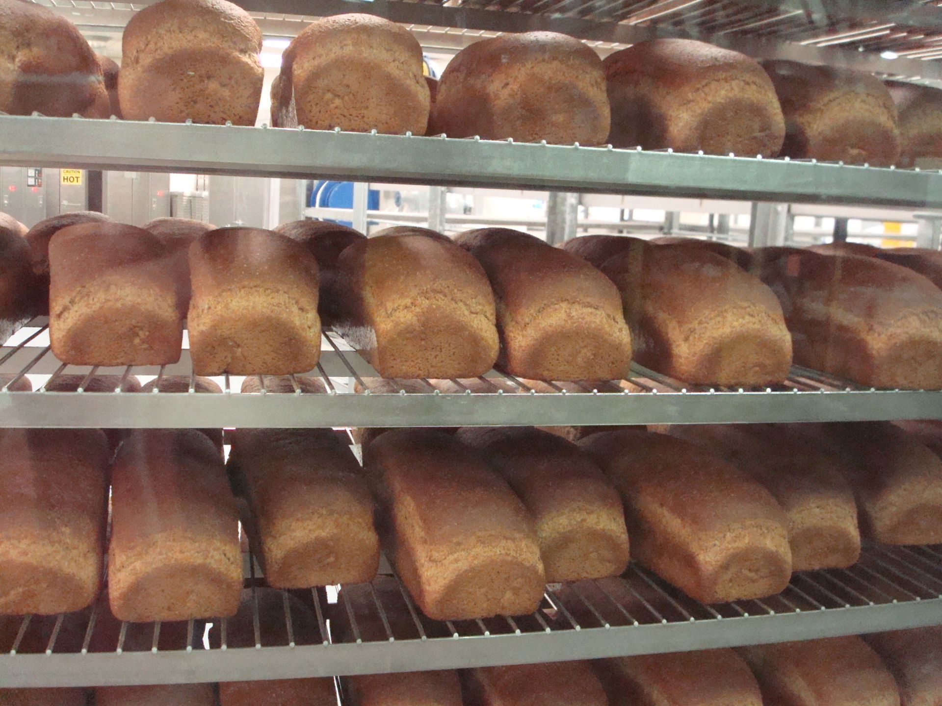 Fresh-baked bread loaves on shelves at the bishops’ storehouse.