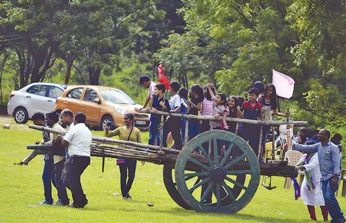 members pulling a handcart