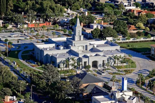 An aerial view of the Córdoba Argentina Temple and the surrounding neighborhood during the daytime.