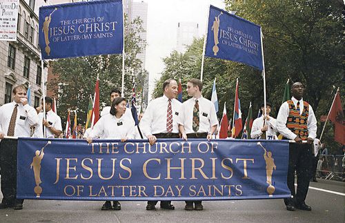 Ronald A. Rasband in parade with missionaries