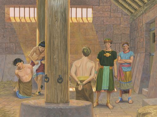 A painting by Jerry Thompson showing Alma and Amulek inside a prison, one tied to a wooden pole and the other kneeling and being hit by a guard.