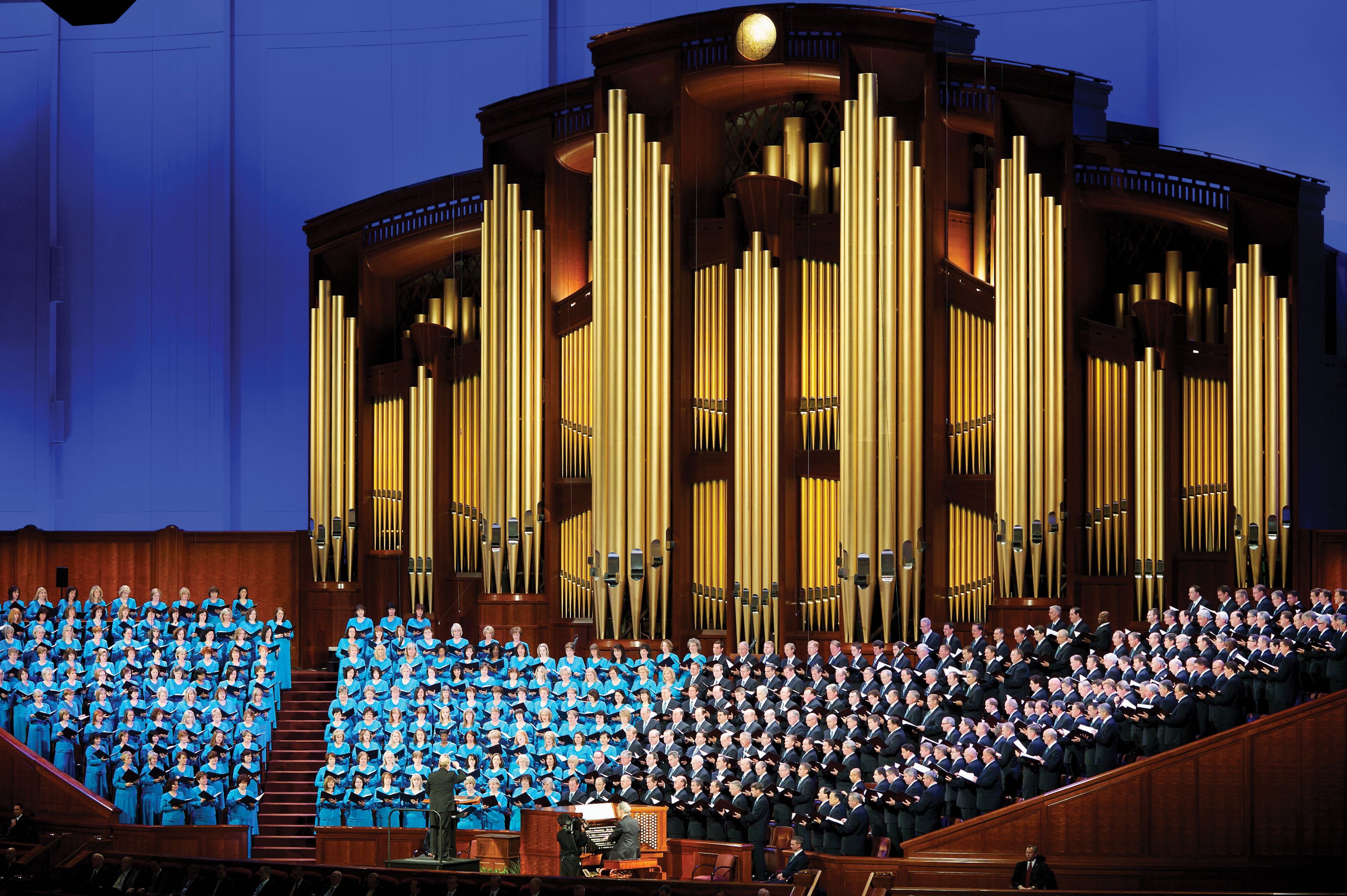 The Mormon Tabernacle Choir standing and singing during a session of general conference.