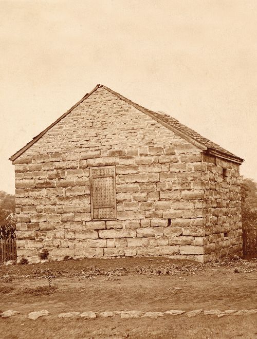 A brown-and-white photograph of Carthage Jail taken in 1896.