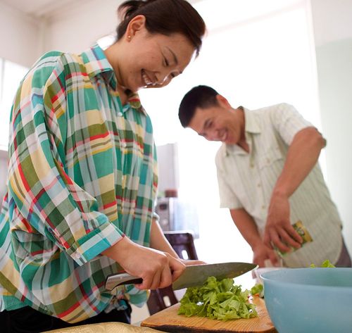 man and woman cooking