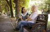 women sitting on bench