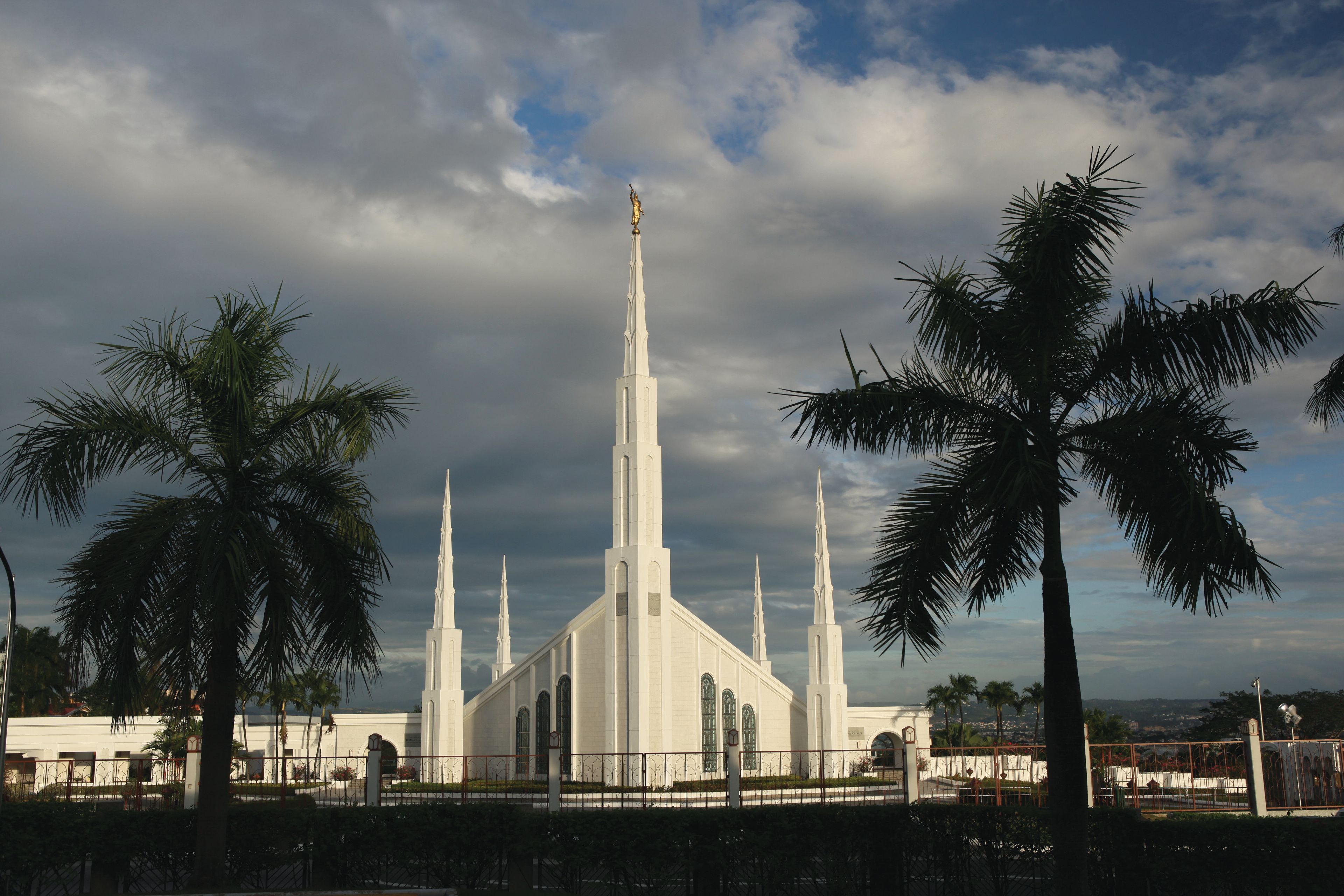 The Manila Philippines Temple during a storm, including the spires and scenery.