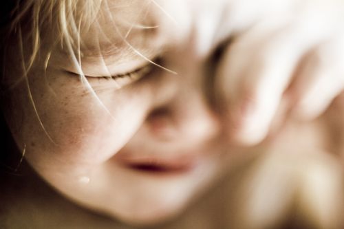 Young child crying.