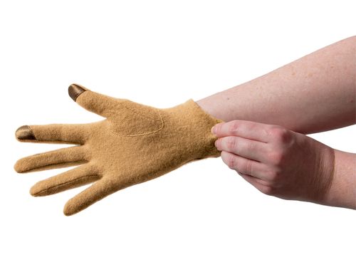 A pair of hands pulling on a glove.