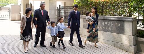 family outside temple