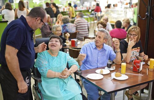 Maio family talking with a friend