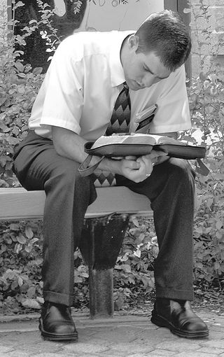 Elder studying scriptures