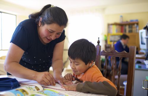 mother helping with schoolwork