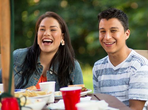 man and woman smiling