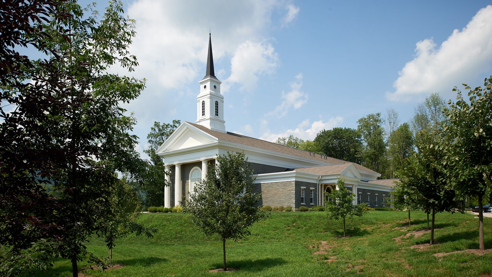 Exterior shots of a church building. There is a sign outside that says it is the Priesthood restoration Site. This is in Pennsylvania.