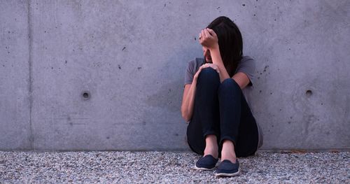 woman sitting alone