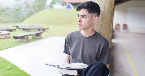 Young Men reading scriptures