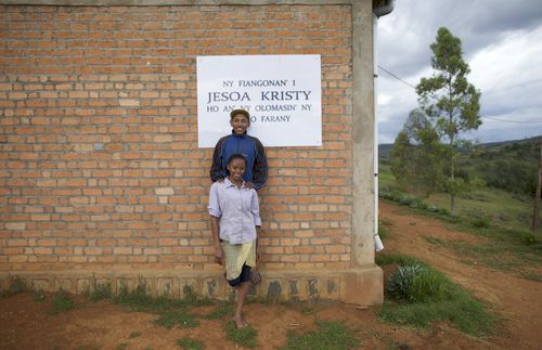 standing in front of a new chapel