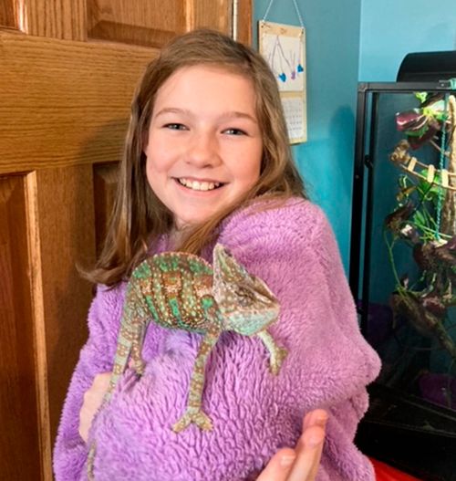 girl holding chameleon