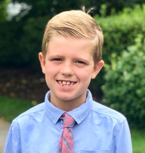 Photo Benjamin Pearson in a blue shirt and a tie.