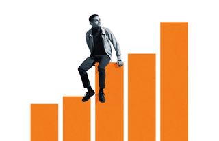 man sitting on bar graph while looking up