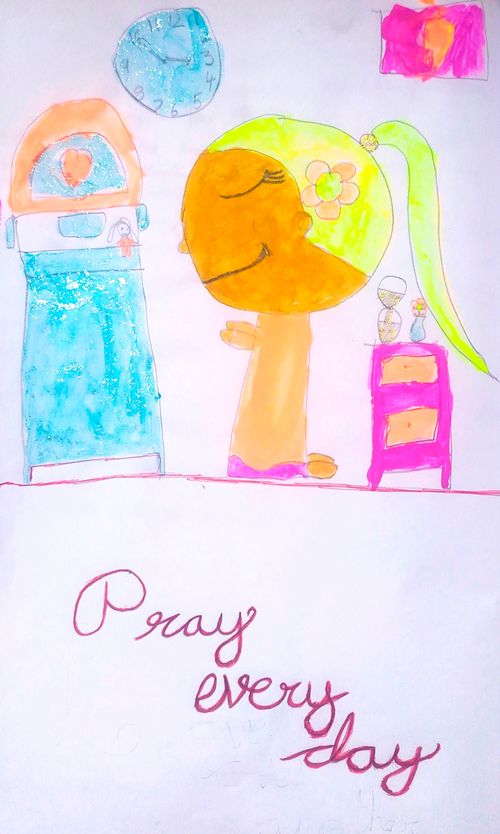 child praying by bedside