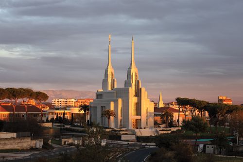 The exterior of the Rome Italy Temple and the surrounding neighborhood at sunrise.