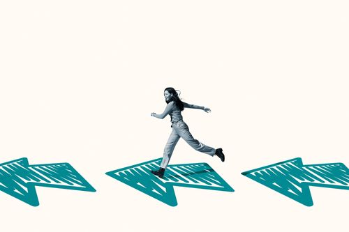 woman running on turquoise arrows