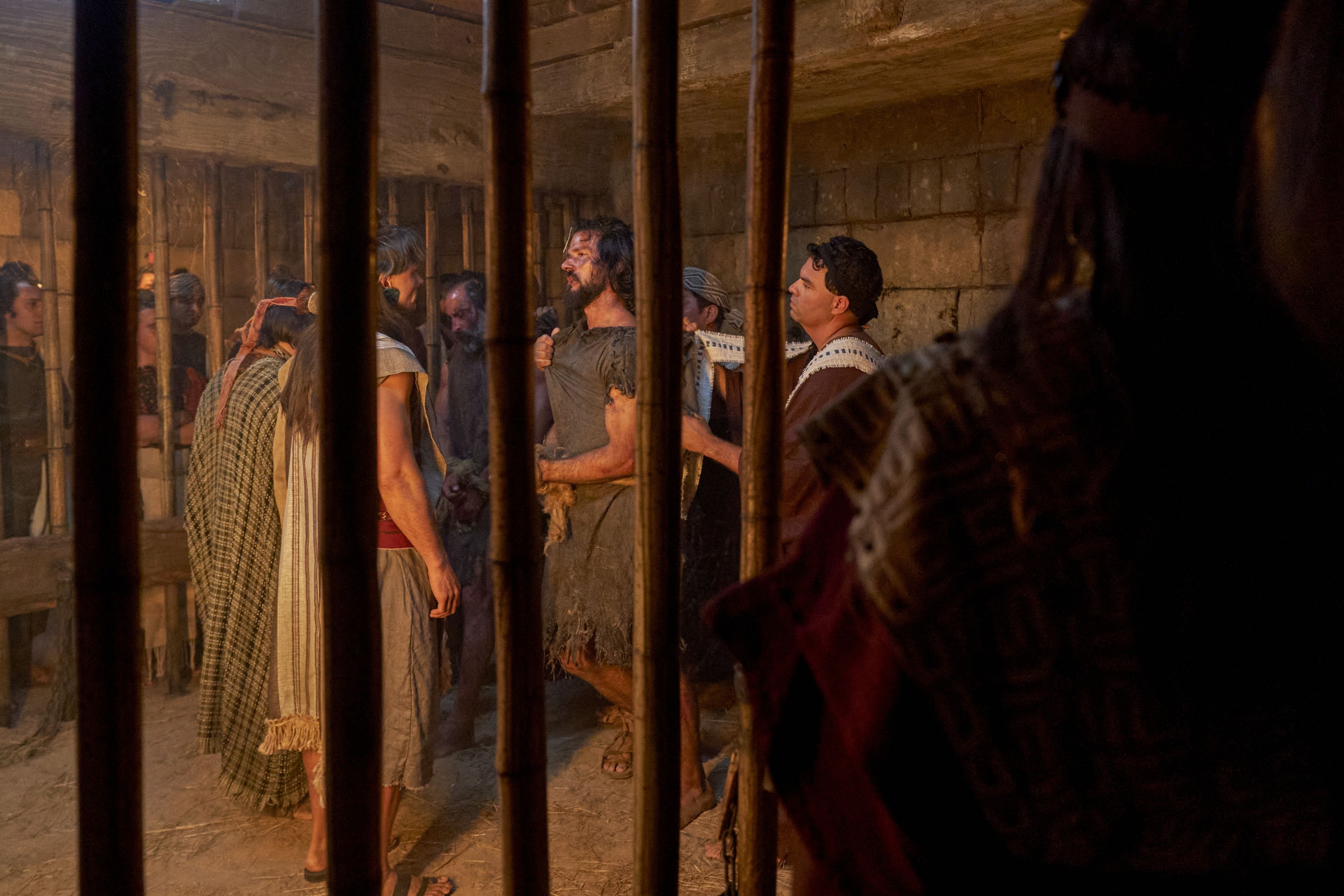 Alma the Younger and Amulek are mocked by the lawyers of Ammonihah while imprisoned.