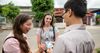 sister missionaries talking to young man