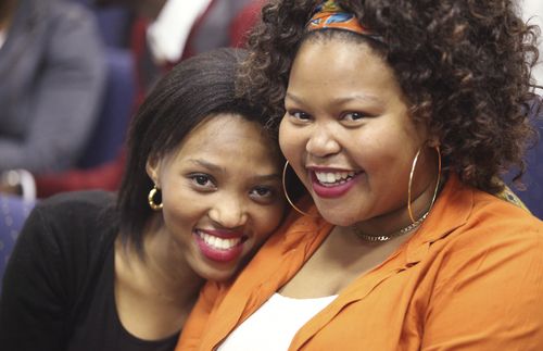 two smiling young women