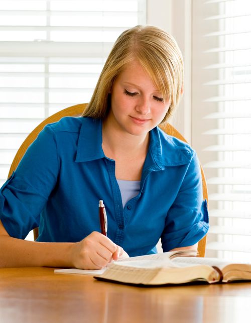 young woman writing
