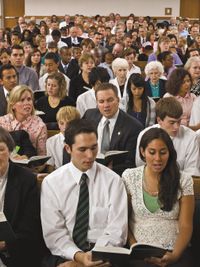 people in pews singing