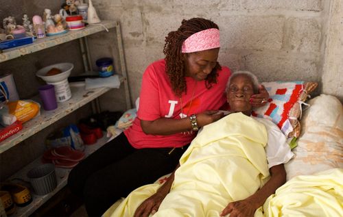 woman helping ill person