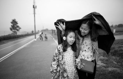 a mother and daughter walking together