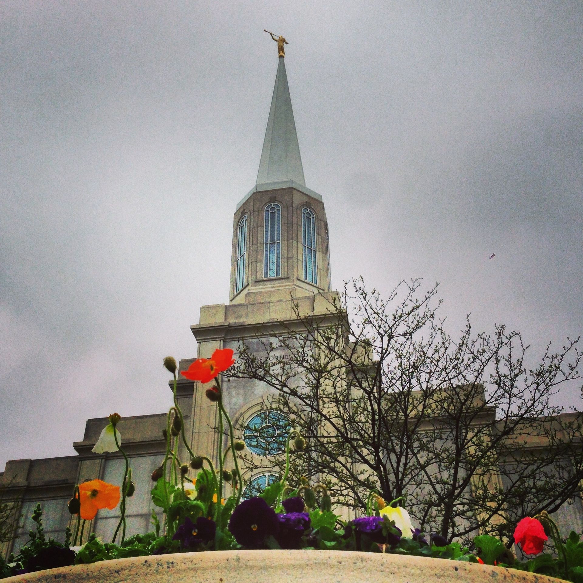 The St. Louis Missouri Temple during a storm, including the spire and scenery.