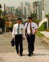 Two missionaries walking down a road in Sao Paulo,Brazil.