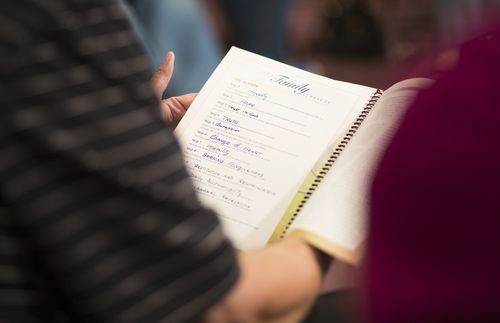 person holding an open notebook