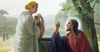 Painting of Jesus and a woman talking next to a well.