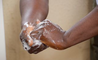 LDS Charities Neonatal training program.  Proper hand washing being demonstrated.