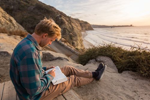 young man studying the scriptures