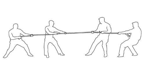 Four men pulling a rope in a tug-of-war.