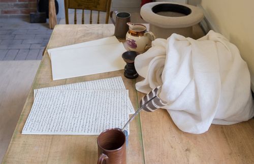 table with various items on it, including a tablecloth