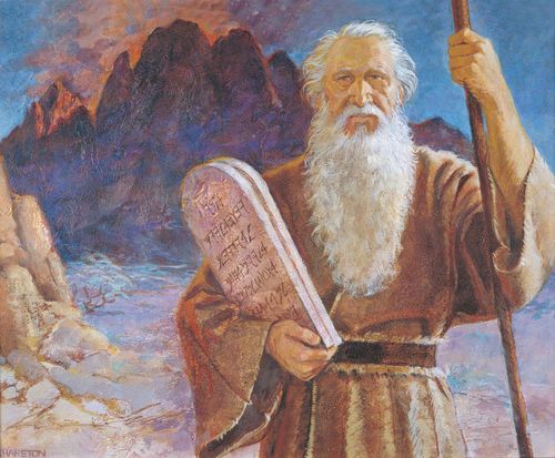 The Old Testament prophet Moses standing near Mount Sinai. Moses is holding the tablets with the Ten Commandments engraved on them.