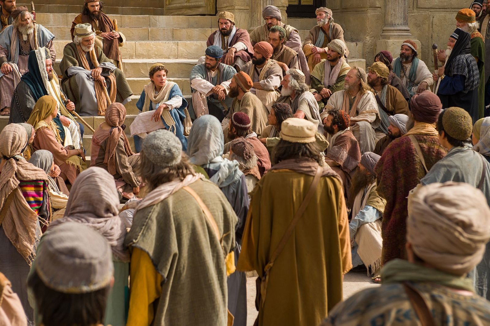 The young Jesus teaches in the temple.