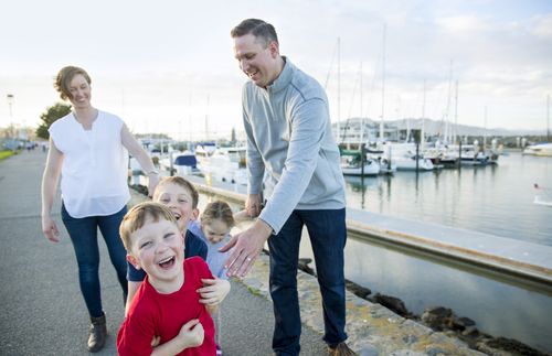 family walking near a harbor