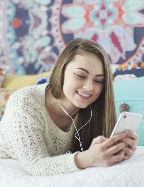 girl with phone smiling