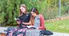 two sister missionaries reading