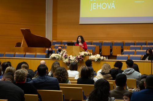 Sister Aburto speaking at youth devotional in Spain