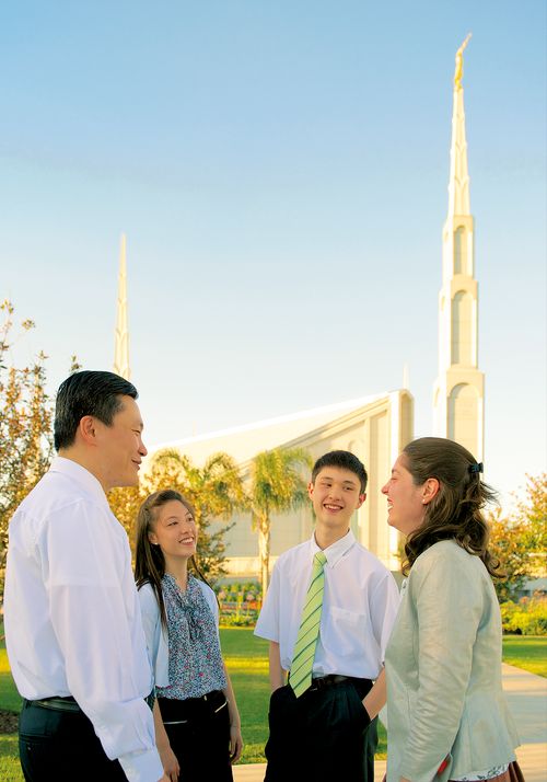 a family in front of the Argentina temple