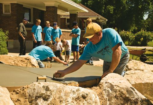 workers smoothing concrete